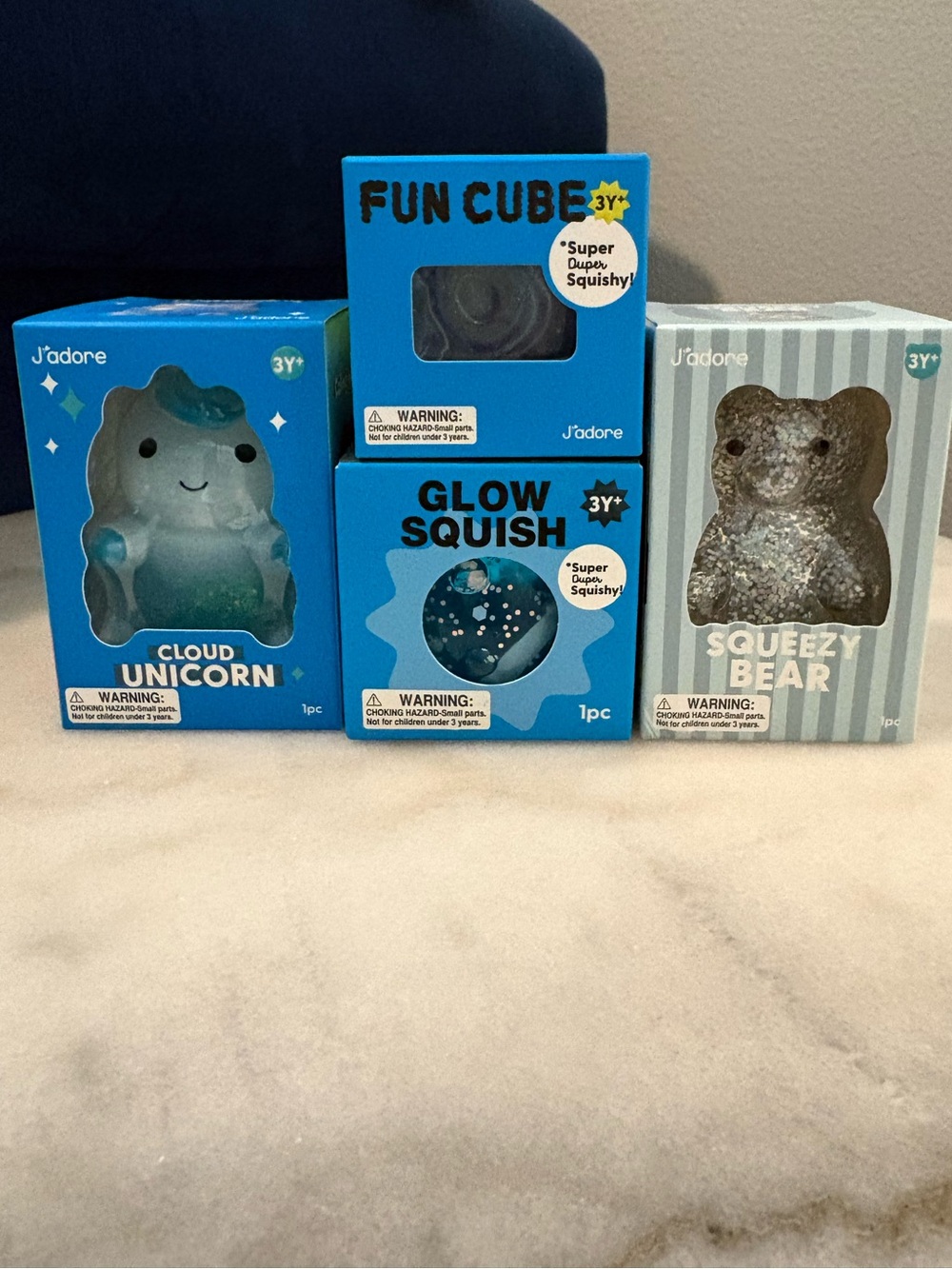 J’adore Squishies Set of 4 - Blue unicorn, cube, glow squish, and silver bear